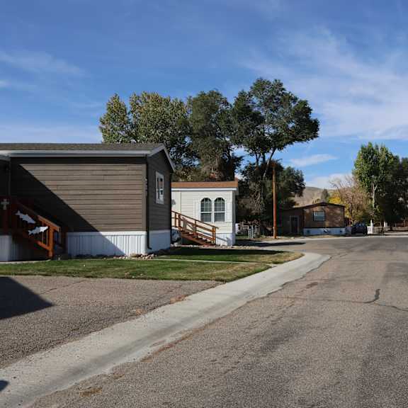 a street with houses and trees on the side of it at Pioneer Park, Green River, Wyoming