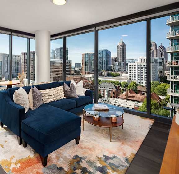A living room with a view of the city at 903 Peachtree in Atlanta, Georgia 30309