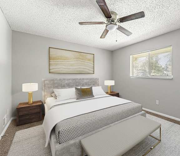 a bedroom with a bed and a ceiling fan