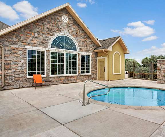 The hot tub with the main office being it at Legends at River Oaks Apartment Homes. 