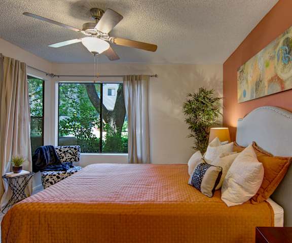 A bedroom with a queen-size bed, closet, and nightstands at Desert Horizon. 