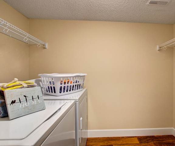 The laundry room at 3600 Brentwood with a washer and dryer 