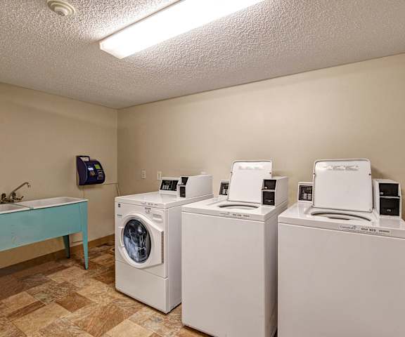 The laundry room with washers and dryers at Lakewood Heights. 