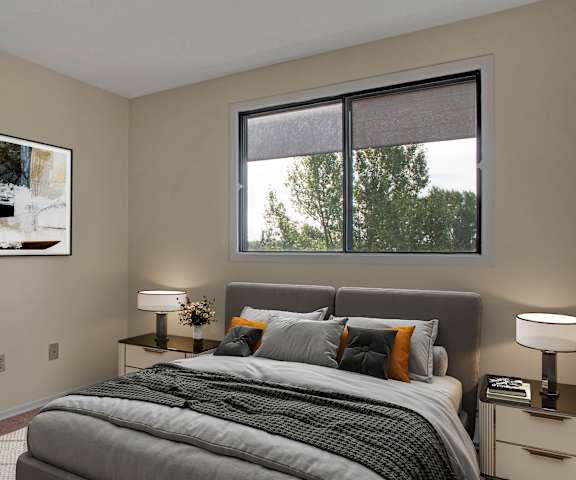 A cozy bedroom with a queen-size bed, artwork, a dresser, decorations, window, and nightstands at Ranchlands Apartment Homes. 