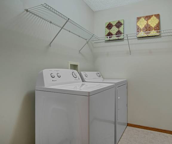 The laundry room with washers and dryers at Windsor Terrace Apartment Homes. 