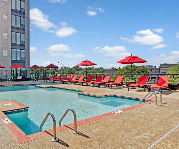 4800 Excelsior Pool with Views The pool with pool chairs, and umbrella at 4800 Excelsior.