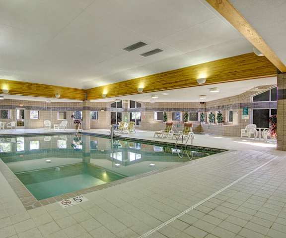 The indoor pool with tables and chairs at Heritage Park. 