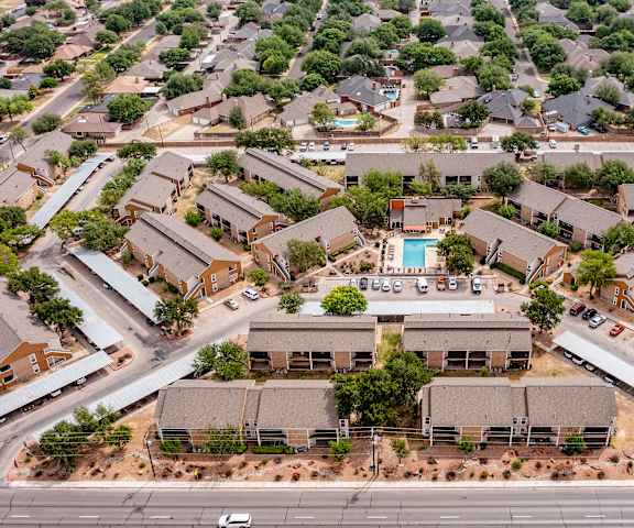 A bird's eye view of the Trinity Place Apartment Homes with houses and a swimming pool.