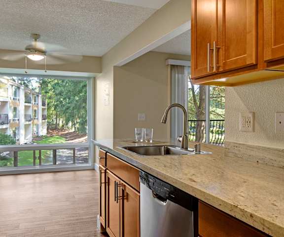 Kitchen and dining area with a large window at Adagio. 
