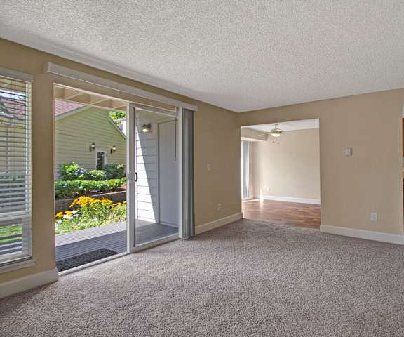 Living room, patio, and kitchen at Adagio. 