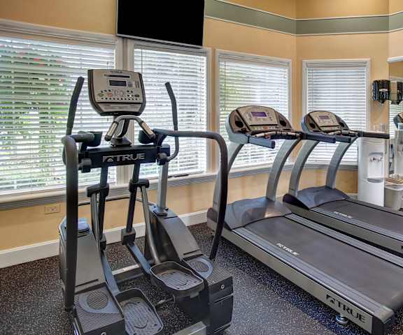 A gym with treadmills and other exercise equipment at Aspen Creek. 