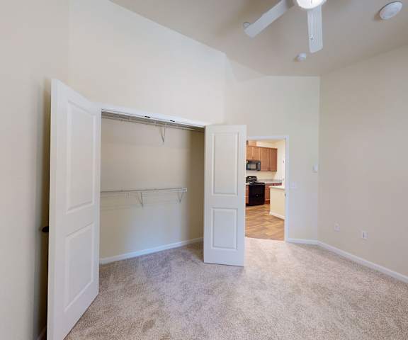 An empty carpeted bedroom with a closet at Leavenworth Haus. 