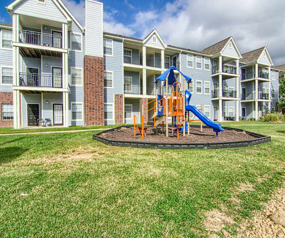 A playground at a park in front of the apartments at Harbin Park Apartment Homes. 