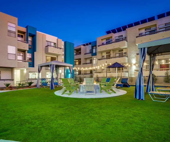 a rendering of a patio with chairs and tables in an apartment building