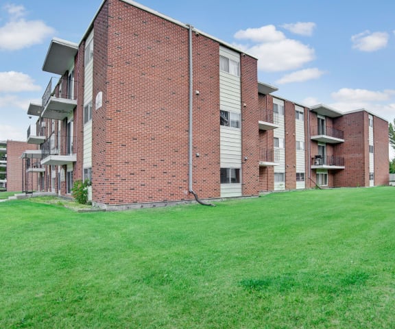 The exterior of the building surrounded by grass
