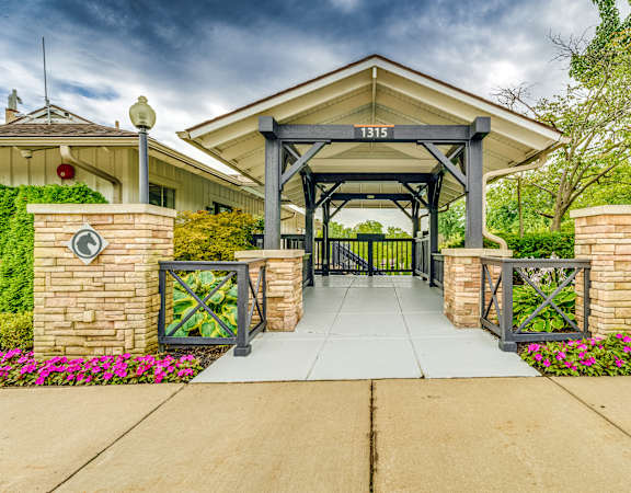 The entrance to a building with a sign that reads "1315" above the gate.