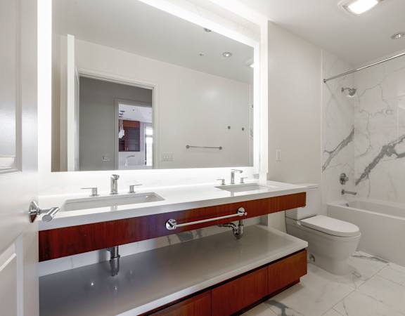 a bathroom with a sink and a mirror and a toilet