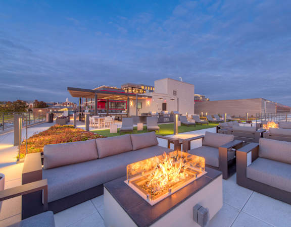 a fire pit on the roof of a building at night