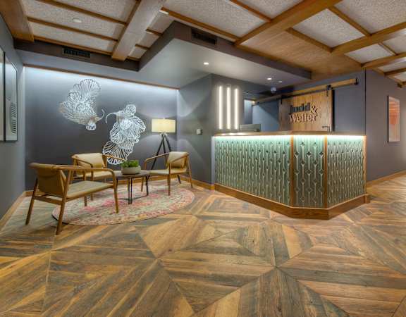 the lobby of a hotel with a reception desk
