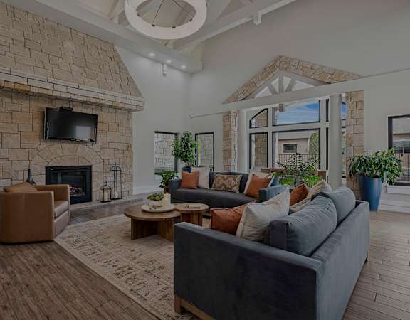 Clubhouse lounge with fireplace - Grand Centennial Apartments