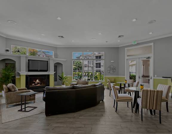 Resident clubhouse with fireplace - Asprey at Lake Brandon Apartments