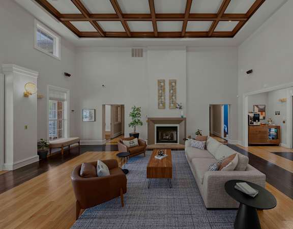 Clubhouse great room with fireplace - Belle Harbour Apartments