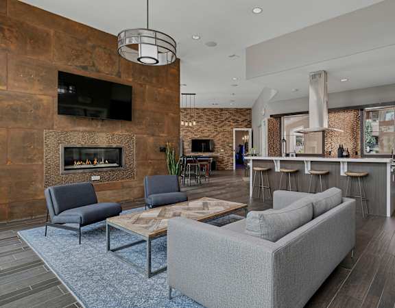 Clubhouse fireplace lounge - First and Main Apartments