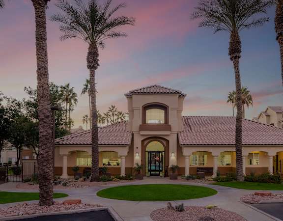 Leasing office main entryway at dusk - Sonterra Apartments at Paradise Valley