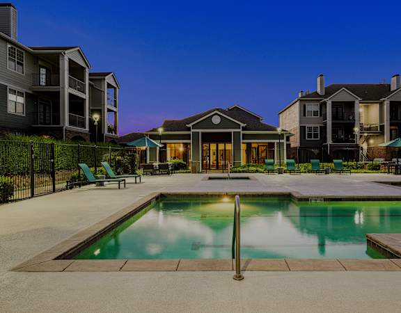 Resort-style swimming pool with ample lounge seating - Emmersyn at Lone Tree