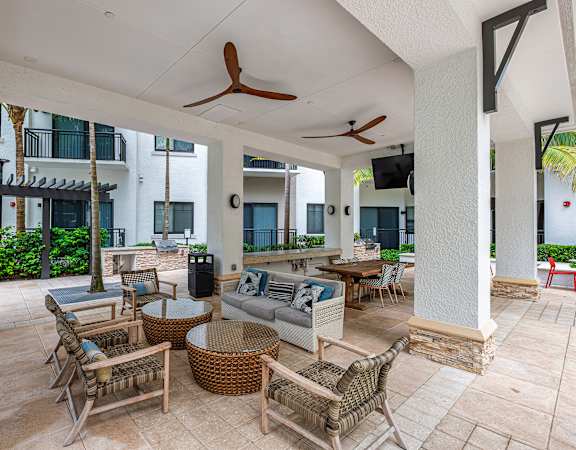 Poolside dining area - The Remy Apartments