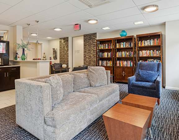 Resident lounge with a library and Starbucks coffee available - Hill House at Chestnut HIll