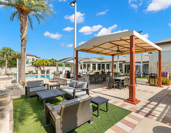 Poolside lounge area- Nona Park Village Apartments