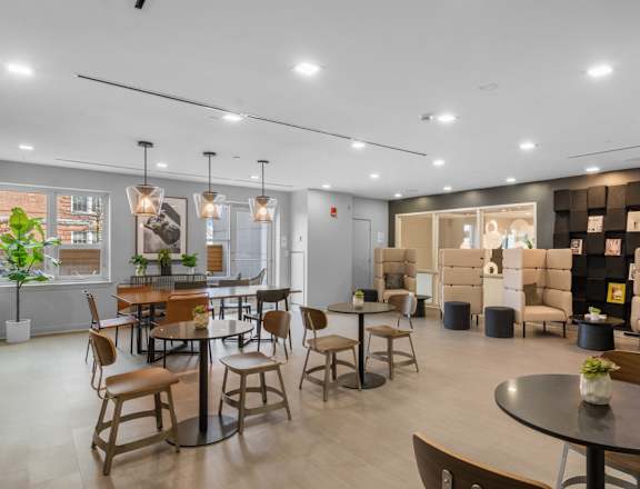 Spacious resident lounge at The Amelia Apartments in Quincy, MA