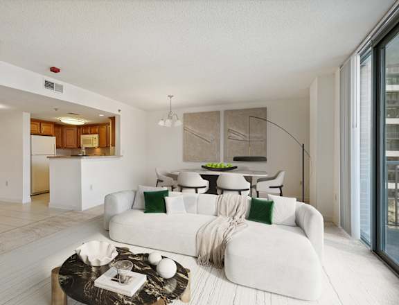 a living room with a white couch and a table