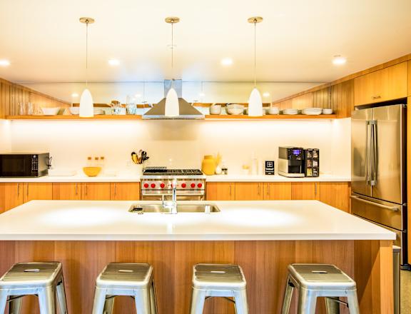 A kitchen with a white counter top and stainless steel appliances.at The Rise, California