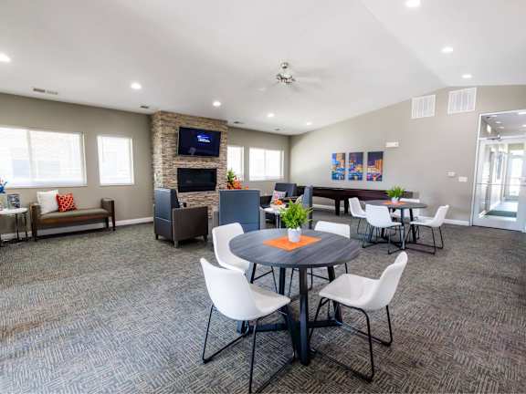 Large Clubhouse With Ample Sitting And Television at Broadway Heights, Indigo Living, IA, 50317