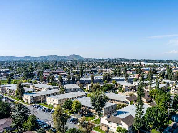 A view of a residential area with houses and trees at Whispering Fountains Riverside, Riverside, 92503