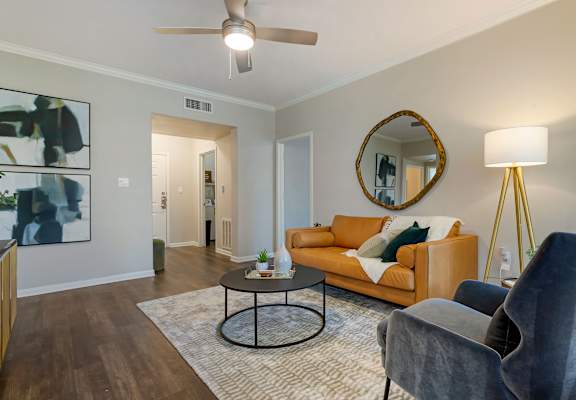 a living room with a couch and a coffee table at Madison on the Meadow in Stafford, Texas 77477