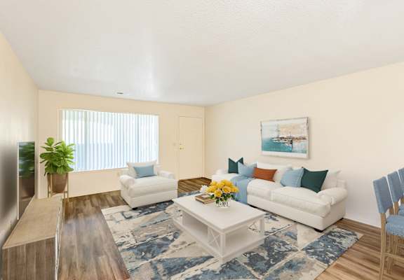a living room with a white couch and a coffee table