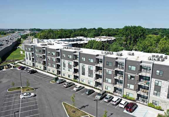 an aerial view of an apartment building overlooking a parking lot at SouthPointe Village Apartments, LP, Fishers, Indiana