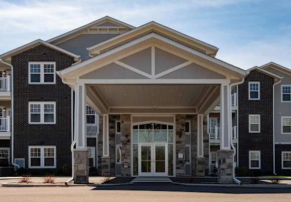 the front of a building with a large entrance at Ritchey Reserve, Fishers, 46038