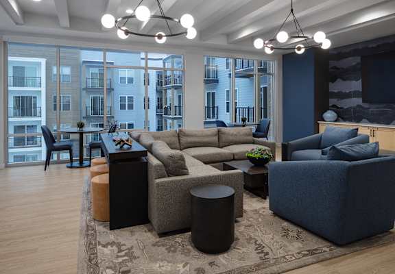 A living room with a large couch and a television.