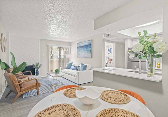 a living room and dining room with a table and chairs at District 2308, Arlington Texas