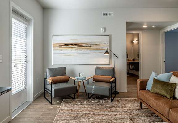 a living room with a couch and chairs and a coffee table at Sagecrest Apartments, Washington, 98801