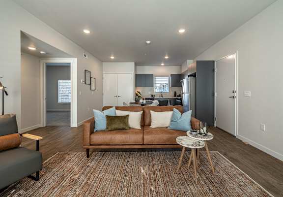 a living room with a couch and a coffee table at Sagecrest Apartments, Washington, 98801