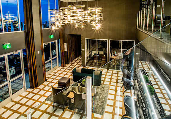 a view of the lobby of a hotel with couches and chairs
