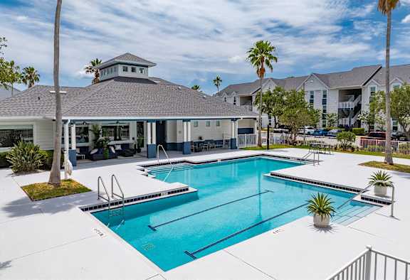 the preserve at ballantyne commons pool and building with palm trees
