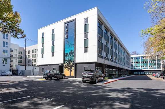 A modern building with the number 7128 on it at THE MOD AT MIDTOWN Apartments, Sacramento, 95814