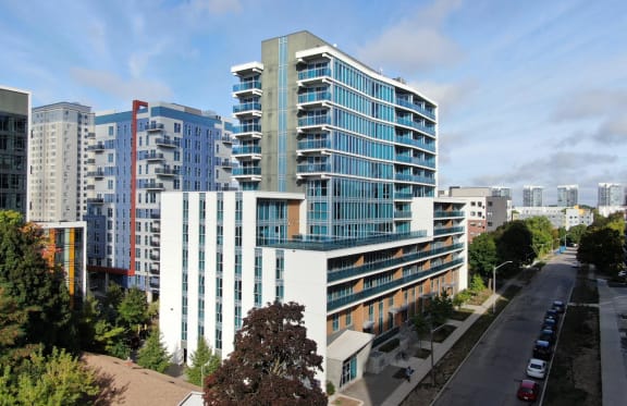 an aerial view of an office building with other buildings in the background