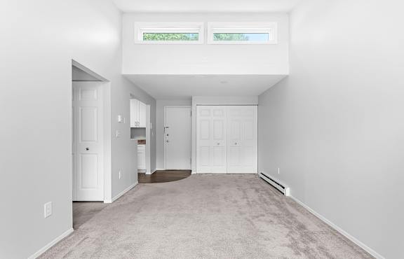 an empty room with white walls and white doors and windows at Gull Harbor Apartments in New London, CT, 06320